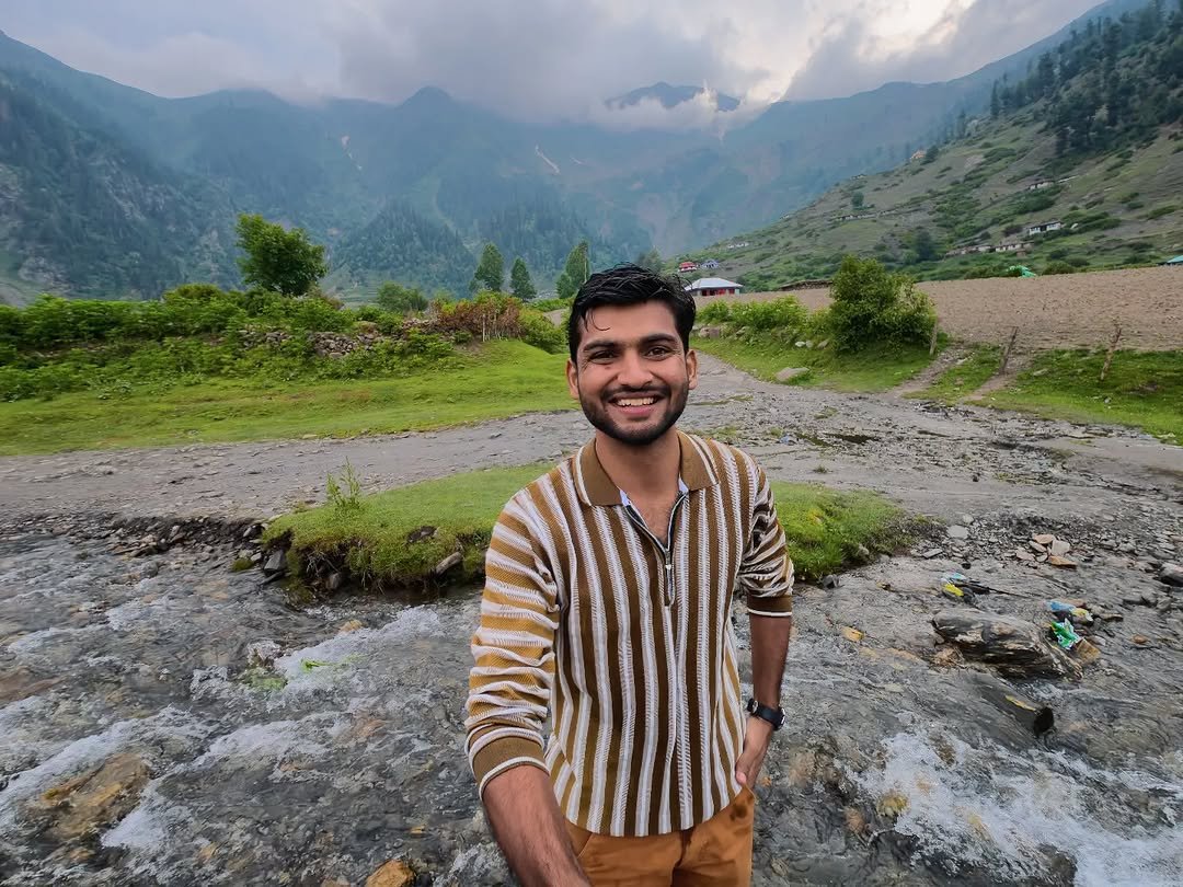 Waleed Ahmad standing at Maidan Meadows, Northern Pakistan